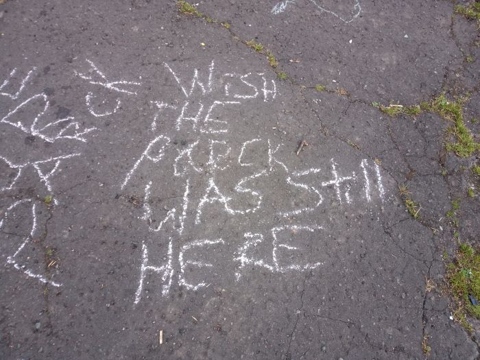 Chalk slogan saying "Wish the park was still here"