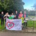 Kirsten Robb with a group of Morishall residents holding a banner asking for a 20mph speed limt