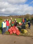 group of residents clean up park